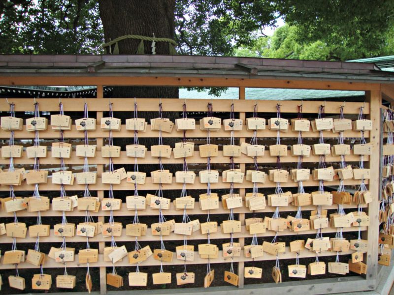 Photo of a board with ema, or wooden prayer blocks.