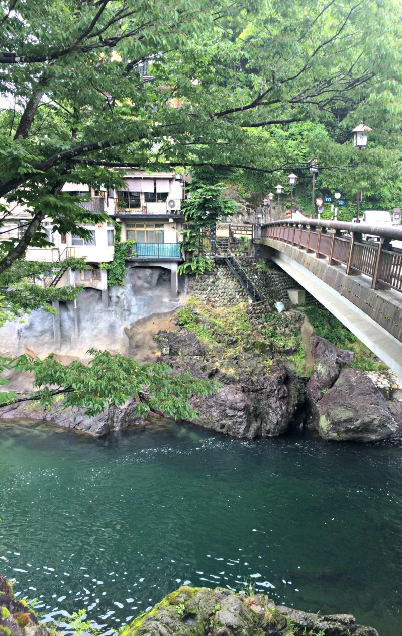 Photo of a bridge overlooking the Yoshida river. Local boys will jump from the bridge into the river during the summer.