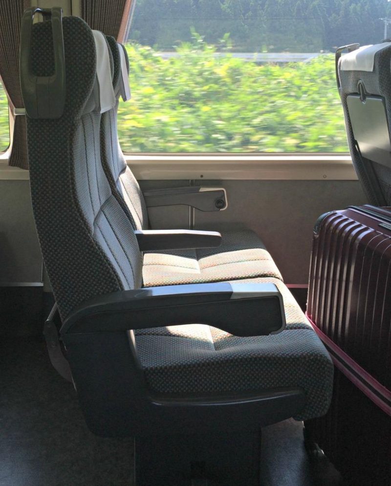 Photo of a train seat on an express train in Japan. For more tips on train travel in Japan, check out this post on Not So Lost in Translation