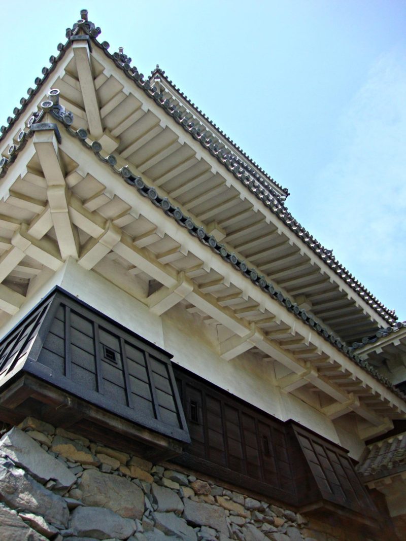 Matsumoto Castle was built on top of heavy stone walls. Most of the windows of the castle are small and would have been used to fire weapons at attackers. 