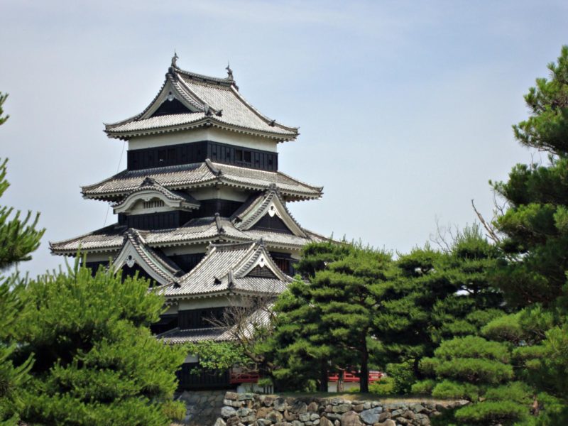 Photo of the main donjon of Matsumoto Castle taken from outside the walls. Matsumoto Castle is one of the 12 remaining original castles in Japan.
