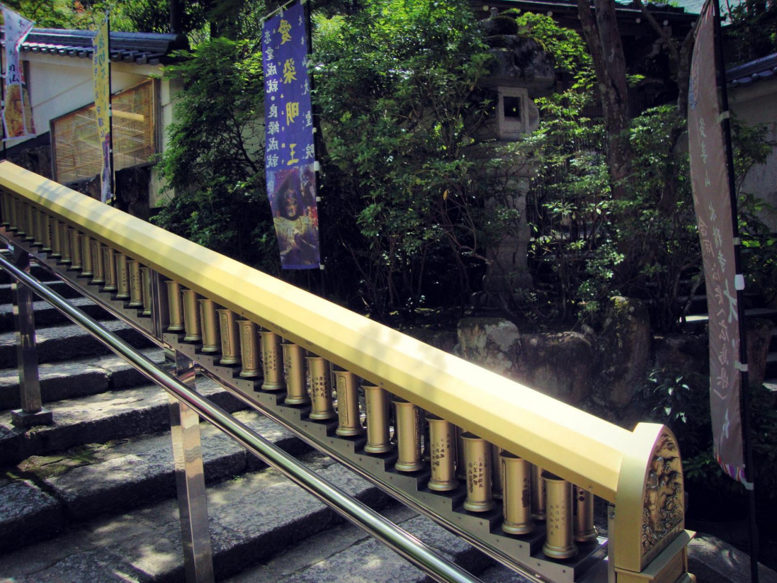 Daisho-in stairway: sutra cylinders. Daisho-in is an overlooked gem on Miyajima Island. Visit this Miyajima Island travel guide for more information.